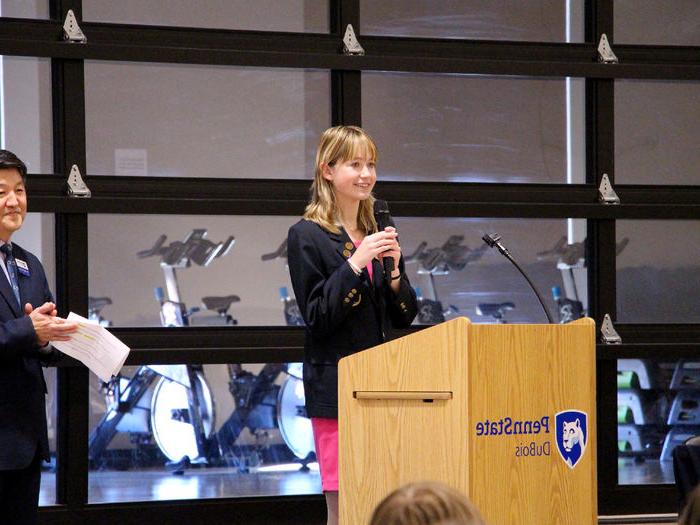 Madigan McGrath, Ridgway student and District 1 representative for Pennsylvania DECA, offers her welcome message at the start of district’s annual conference, held at Penn State DuBois.